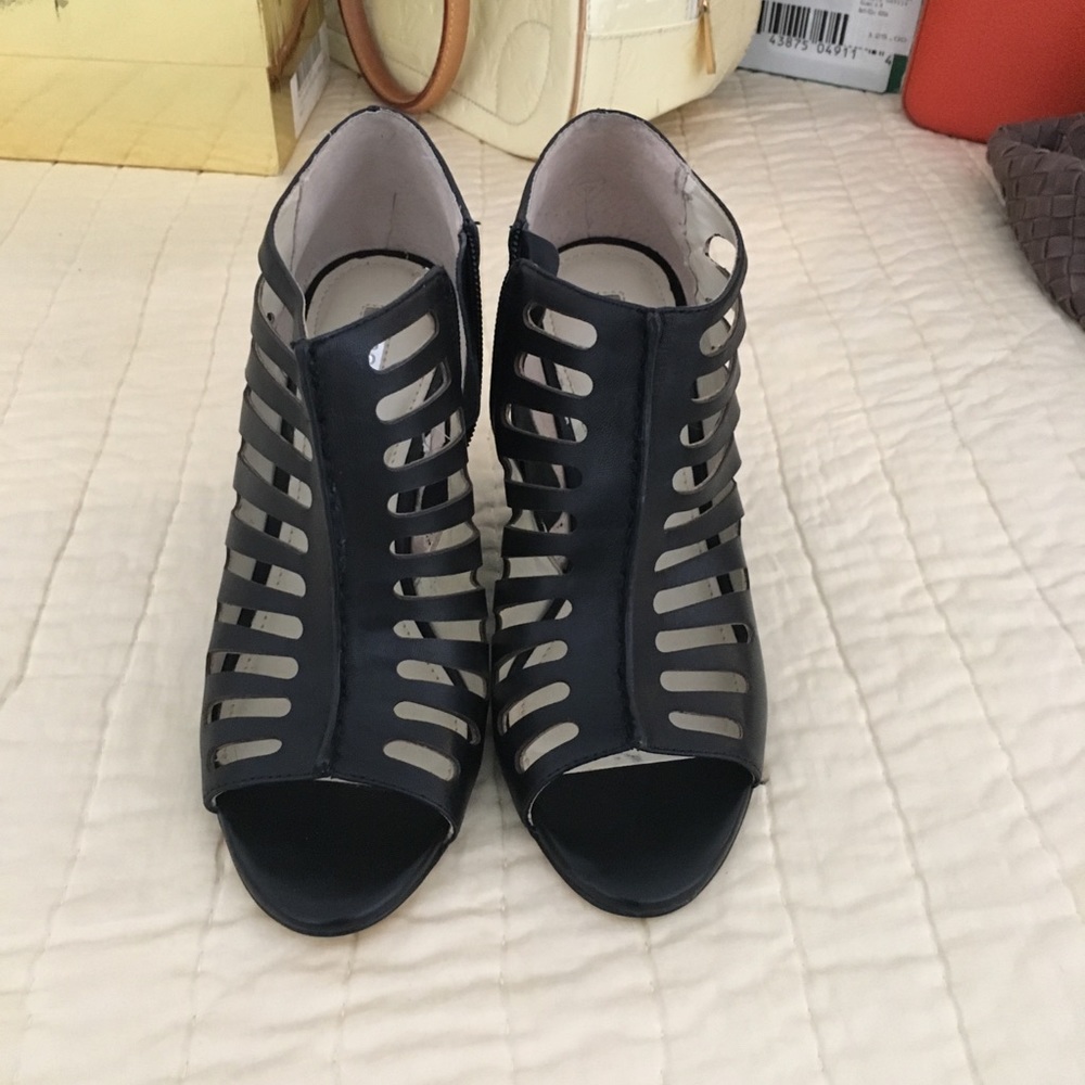 Brand new BCBG Black heals in mint condition